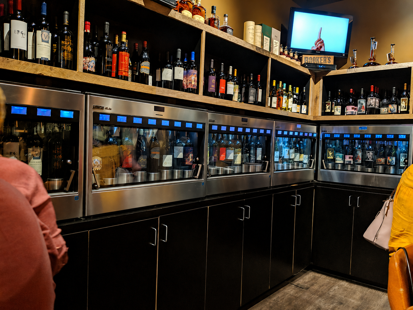 POUR's self-serve wine dispensers stocked with bottles by the glass